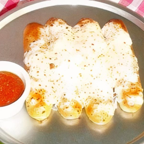 Cheesy breadsticks with melted mozzarella and herbs, served with a side of marinara sauce.